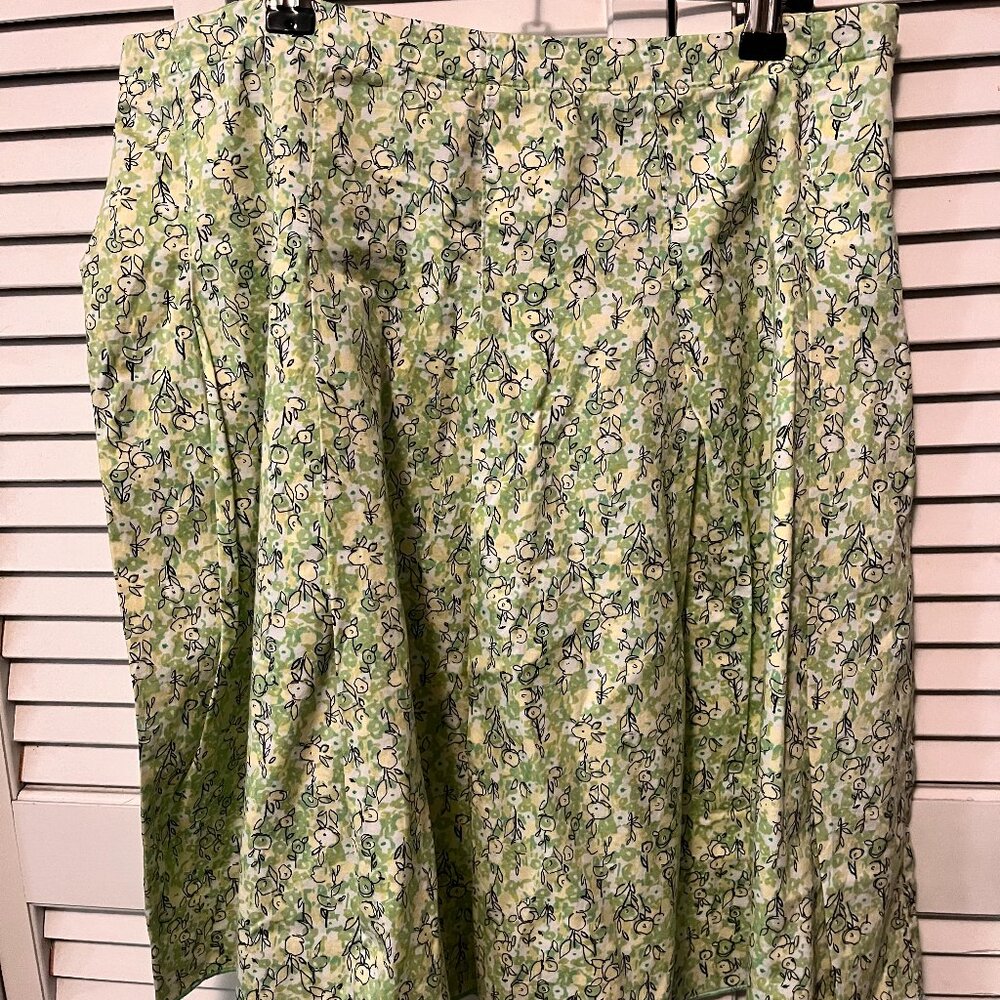 Pleated skirt, knee length, stitched down pleats, yellow & green print. Size 10.